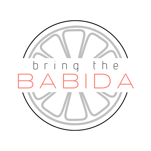 This is our company logo.  It's the shape of a citrus slice with BRING THE BABIDA across the middle.  We think it perfectly represents the fresh flavour you get from our finely curated fruits and spices for all of our Sangria recipes. 